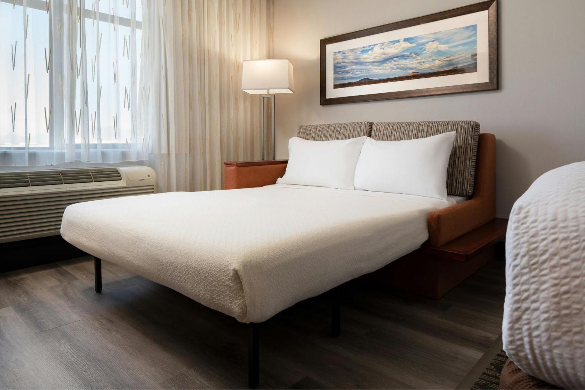 Habitación Executive con cama extragrande, sofá cama y balcón