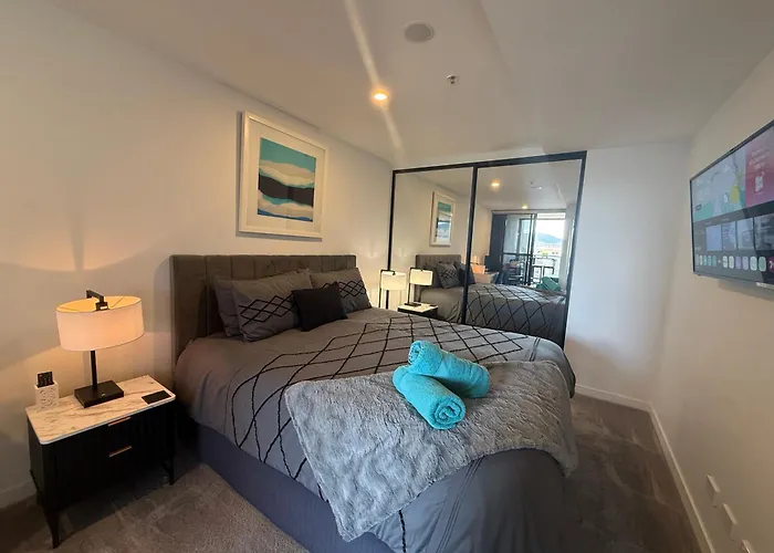 Midnight Luxe: Urban Braddon Apartment with Skyline Views