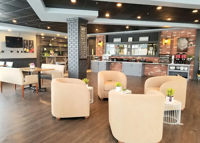 Merit Hotel & Suites